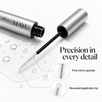 Close-up of the Mayu lash serum applicator with a fine micro-spoolie and rounded tip